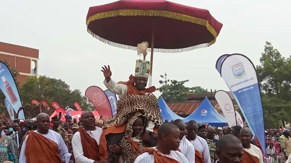Kabaka Mutebi being hoisted high by his subjects
