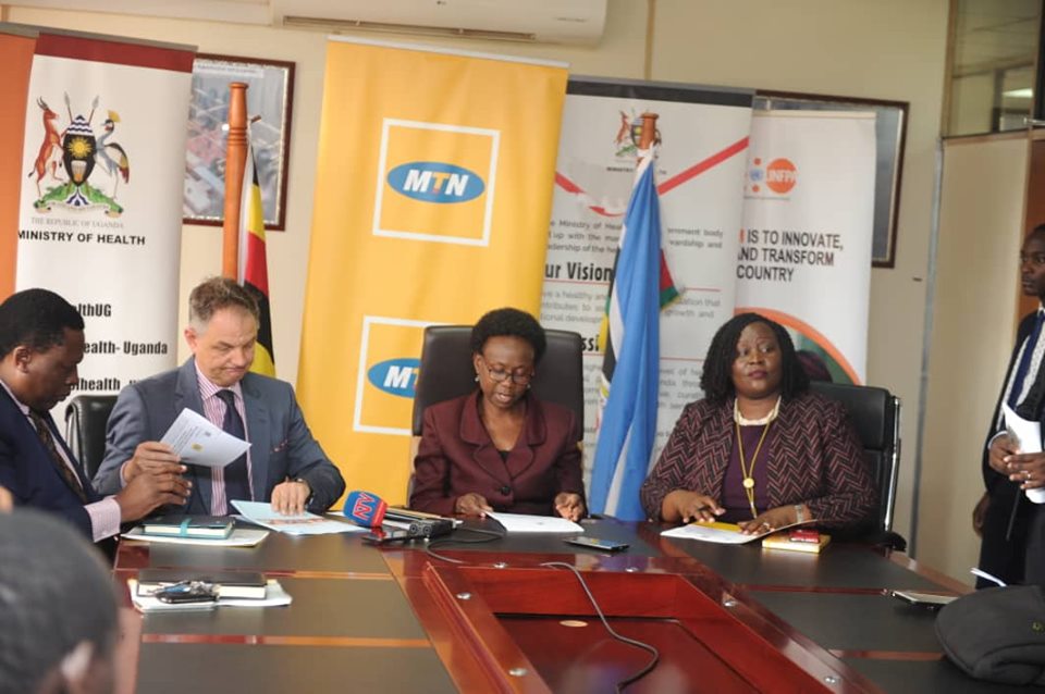MTN Bosses with Minister Jane Ruth Aceng