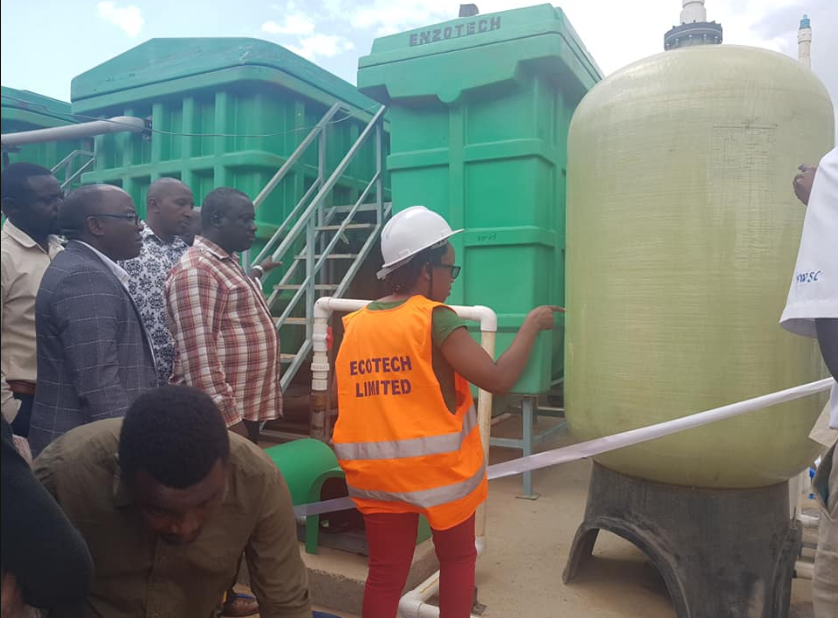 Ruhunda and other officials touring the treatment plant