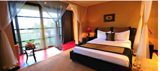 A deluxe room at Common Wealth Resort Hotel