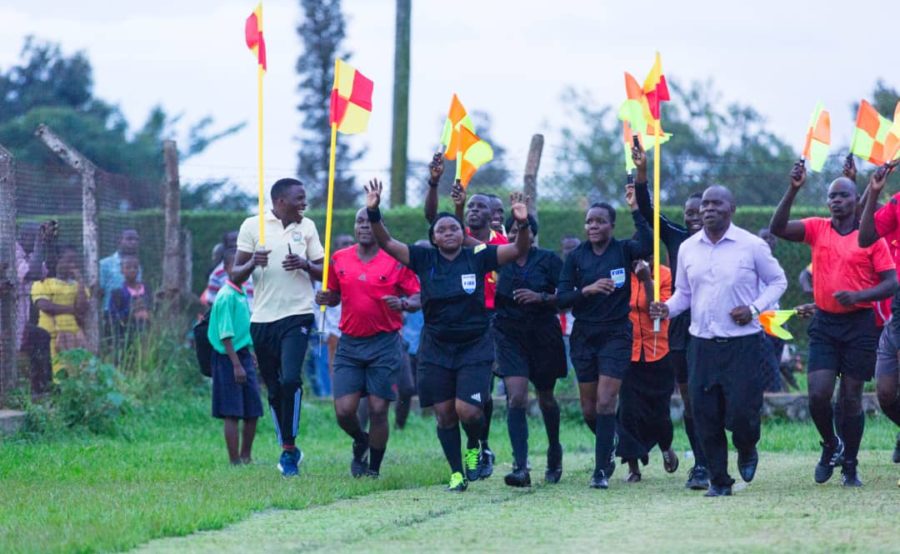 Aisha Nabikko Ssemambo jogging with other referees
