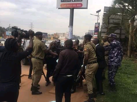 Uganda Police officers brutalising journalists