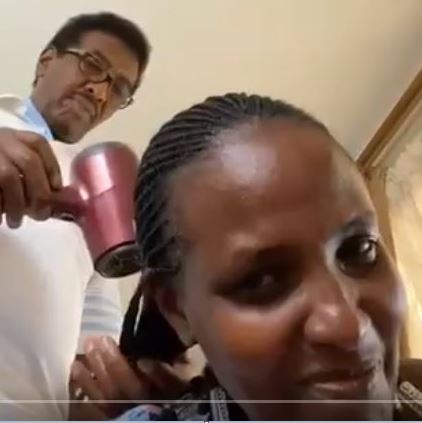 Survival Instincts:Ex-Minister Jim Muhwezi Turns  Hair Dresser To Cut Costs During COVID-19 Lockdown