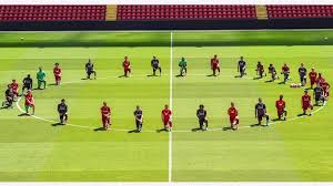 Liverpool Players Pay Tribute To Floyd By Taking Knee At Anfield, FIFA Speaks Out On Purnishing Them.