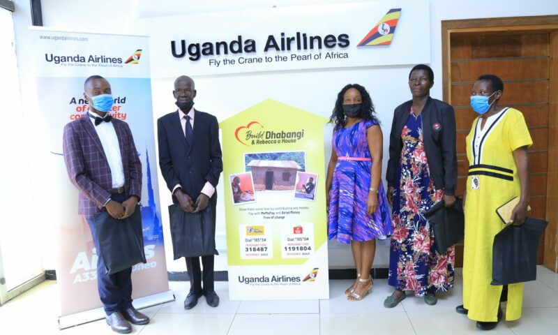 Mzee Wilson Dhabangi & Rebecca Mukyale On Cloud9 As Uganda Airlines Launches Drive To Build For Them Swanky Houses